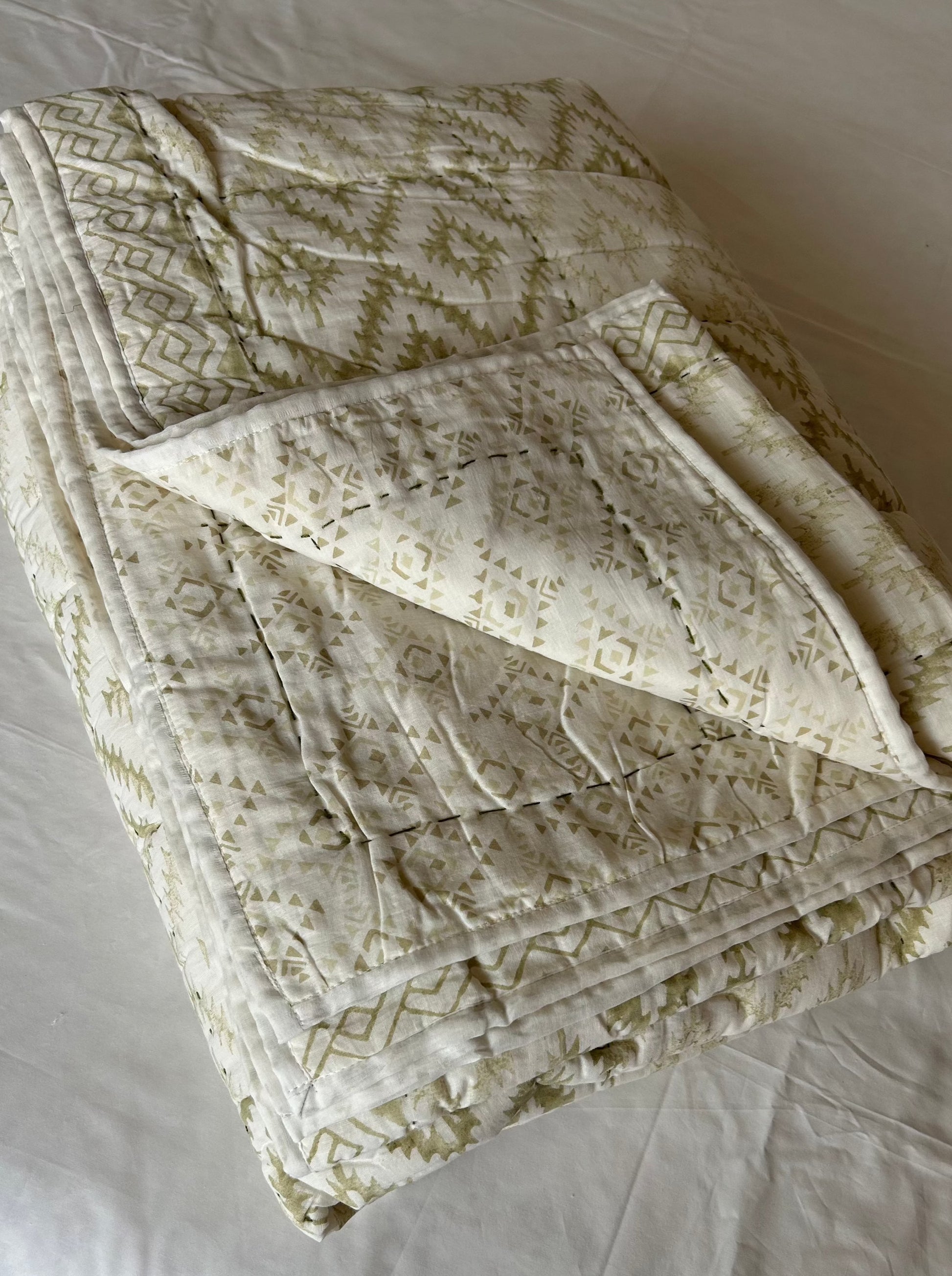 Light green patterned reversible cotton quilt